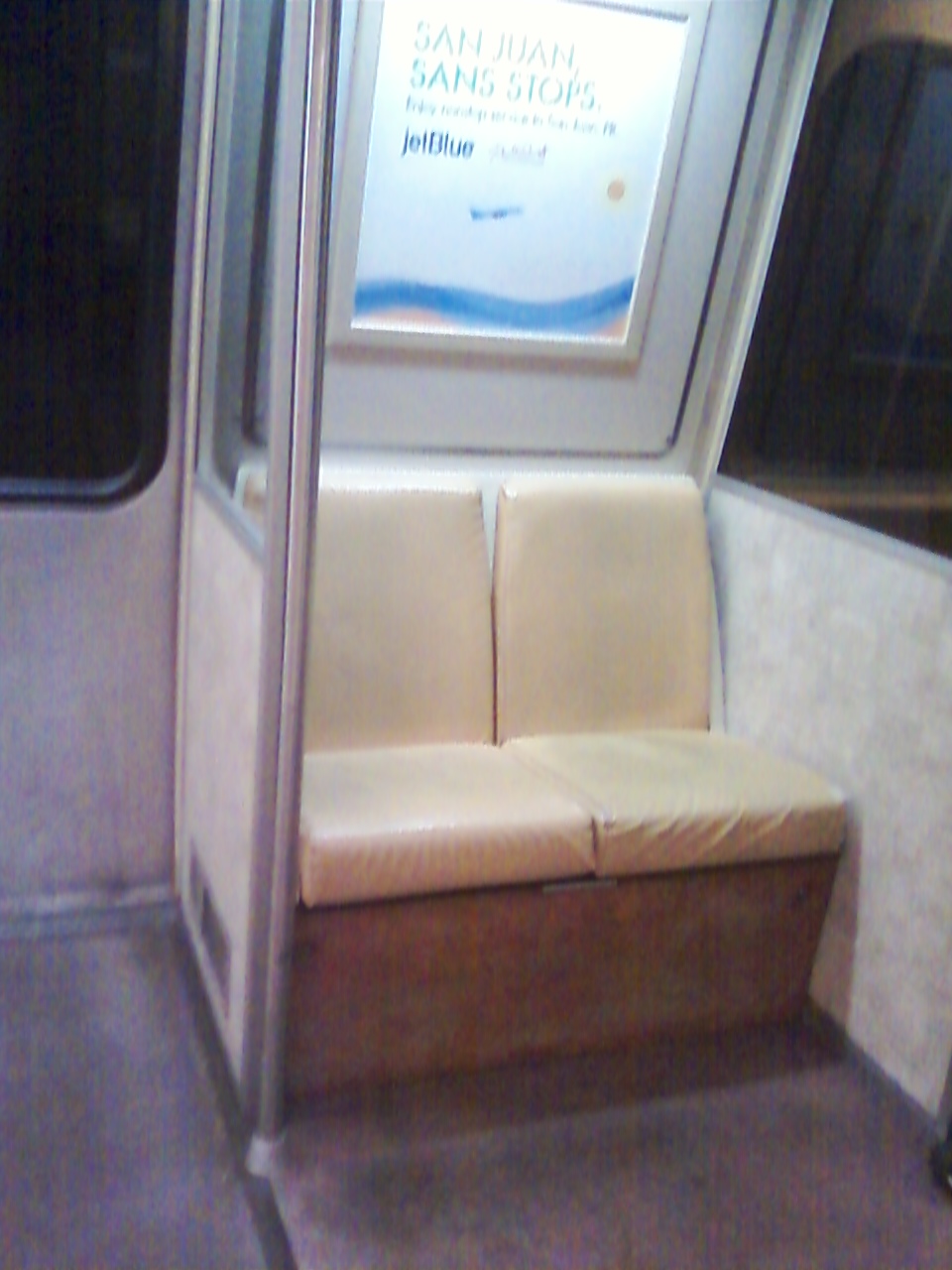 WMATA/DC Metro 2-seat set-aside section of car 1183; note that the 
two seat sections (one on each side of the car immediately adjacent to the
motorman's cab) are protected from outdoor weather and elements, as well
as the rest of the car body, but plastic dividers. For further details,
please visit www.wirelessnotes.org.